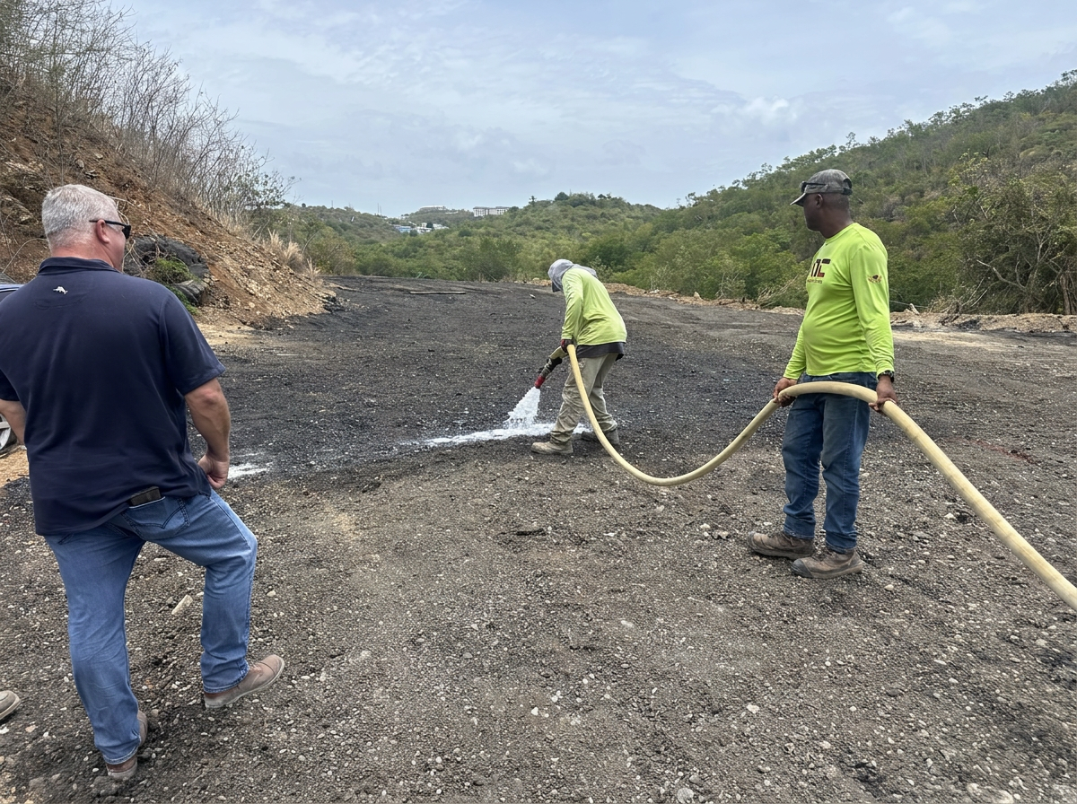 Three-person crew applying Solid Earth soil stabilizer at a US Virgin Islands project